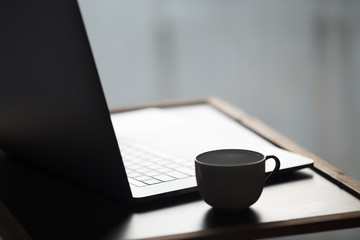 Laptop with hot coffee