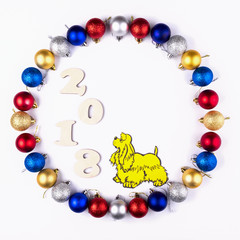 New Year, Christmas Wreath of Colorful Balls with Yellow Dog. Top View.