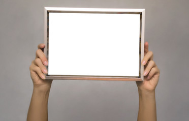 Special offer. Female hands holding empty blank photo frame above a head. Grateful letter. Gratitude concept. Thanks letter.
