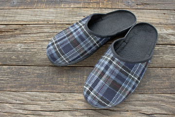House slippers on wooden floor background