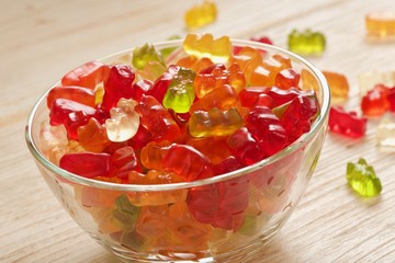gummy bears on wooden background