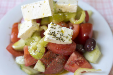 Real Greek salad on the table at a tavern in Greece