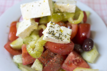 Real Greek salad on the table at a tavern in Greece