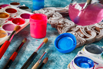 Gouache paints and art brushes for the artist with a copy space