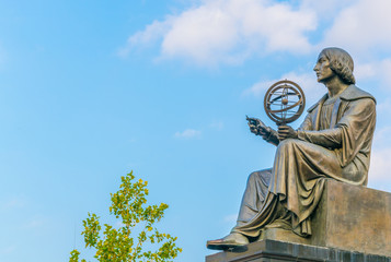 Statue of astromoner Copernicus in Warsaw Poland in front of Academy of Science - obrazy, fototapety, plakaty