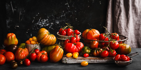 Tomatoes group Ripe abundance tomatoes on a table 