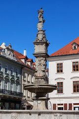 Fototapeta na wymiar Roland Fountain (Maximilian Fountain) topped by a statue of a knight in Bratislava Old Town, Slovakia, 16th century city landmark