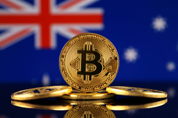 Physical version of Bitcoin (new virtual money) and Australia Flag. Conceptual image for investors in cryptocurrency and Blockchain Technology in Australia.