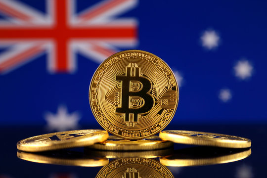 Physical version of Bitcoin (new virtual money) and Australia Flag. Conceptual image for investors in cryptocurrency and Blockchain Technology in Australia.