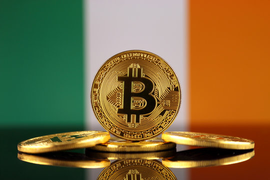 Physical version of Bitcoin (new virtual money) and Ireland Flag. Conceptual image for investors in cryptocurrency and Blockchain Technology in Ireland.