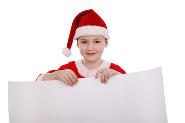 Boy in a suit of Santa Claus holds a white banner label isolated on white background
