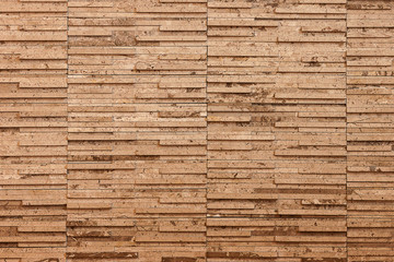 Sandstone wall is the background.