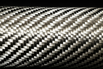 Fototapeta premium Carbon fiber raw composite texture close up