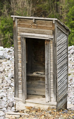 Fototapeta na wymiar An Old Outhouse in a Rocky Mountain Ghost Town