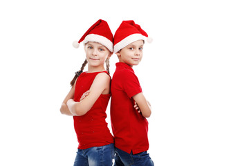Children boy and girl with Santa hat on white background isolated