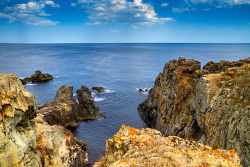 Coastal rocky landscape under the sky with clouds, seashore near city of Sozopol in Bulgaria