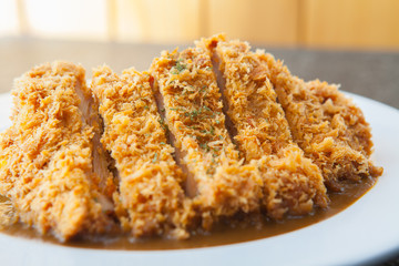japanese curry with fried pork cutlet tonkatsu close up