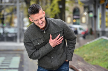 young man hearth attack in autumn