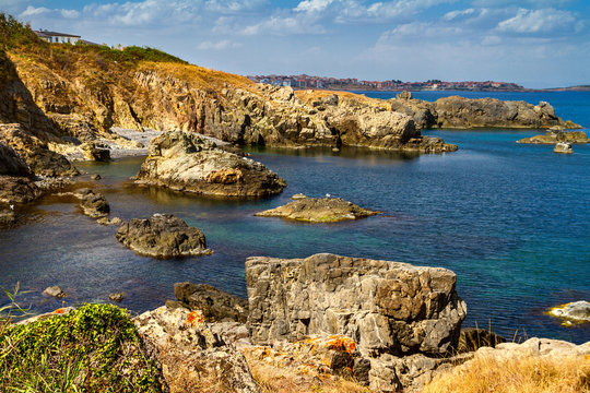 Coastal landscape - the rocky seashore with the village of Sozopolis, near city of Sozopol in Bulgaria