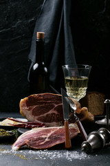 Prosciutto Ham served on a rustic wooden board