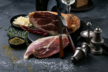 Prosciutto Ham served on a rustic wooden board