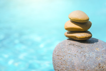 Fototapeta na wymiar Zen Stones / Zen stone on pool side for perfect meditation