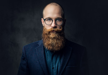 Redhead bearded male in a suit. - obrazy, fototapety, plakaty