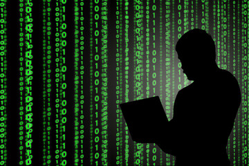 Young hacker in data security concept