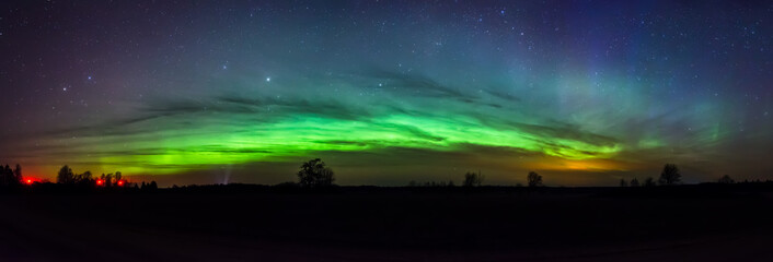 Green arc of aurora borealis in Estonia sky - 181364994