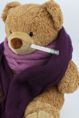 teddy bear with fever thermometer
