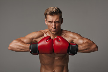 Determined sportsman in red gloves