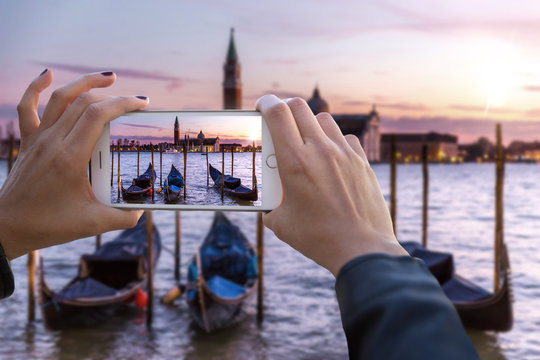 First person perspective point of view hands holding smartphone capturing footage of holiday travels in europe 