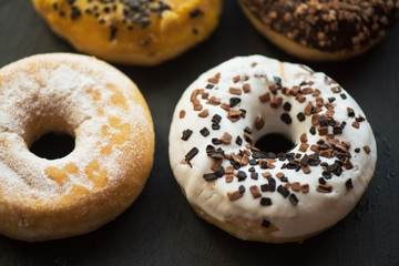Set of donuts on black background
