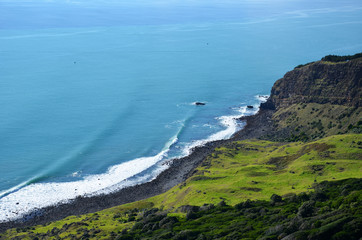 Fototapeta na wymiar View from the cliff top of the Raglan coast in New Zealand