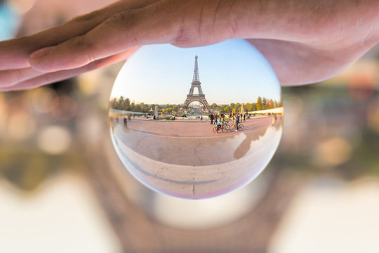 The Eiffel tower seen through a crystal ball, Paris France