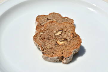 Pieces of domestic, home-made bread with wholegrain and nuts, close-up