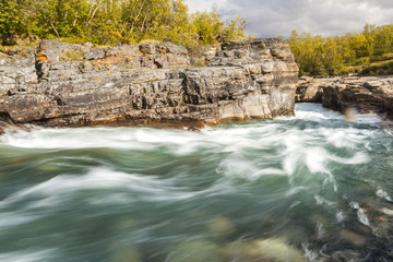 Fototapeta na wymiar Rapid waters of the lower run of the Abisko river