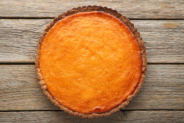 Pumpkin tart on grey wooden table
