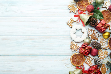 Gingerbread cookies with chrismas decorations on wooden table