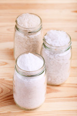 Salt shakers on brown wooden table