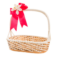 Fototapeta na wymiar Empty wicker basket with bow isolated on white background