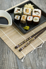 Set of sushi and chopsticks, traditional asian dishes.