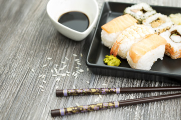 Set of sushi and chopsticks, traditional asian dishes.