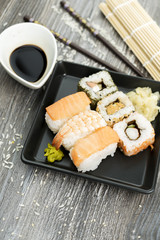 Set of sushi and chopsticks, traditional asian dishes.