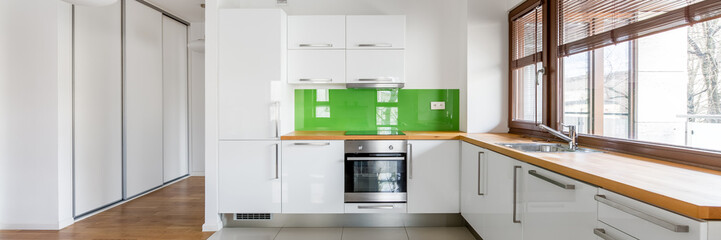 White, open kitchen with window