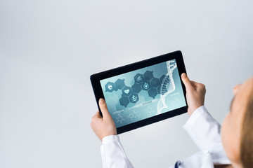 Close of female doctor hands working with tablet pc computer