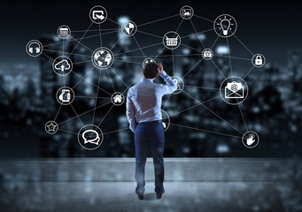 Businessman watching social network interface on a rooftop 3D rendering