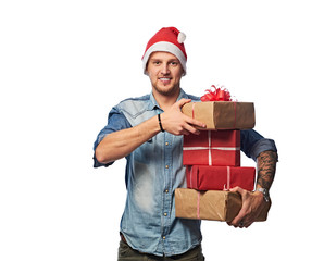 A man holds Christmas gifts.