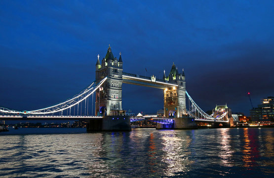 Tower Bridge over the thames river at night in London, United Kingdom, England