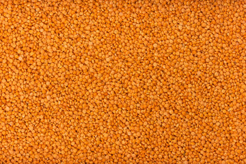 Red lentils background or texture